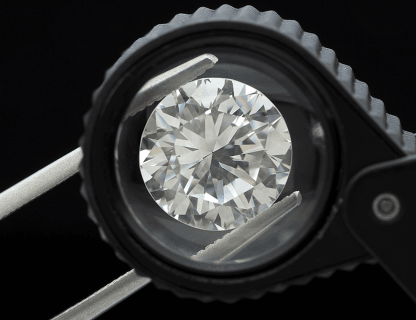 Round lab-grown diamond under inspection